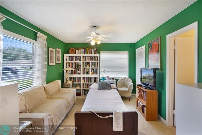 8625 Boca Drive, Unit 12 Boca Raton, FL 33433 - Photo 12 of 42 a living room with furniture and a large window