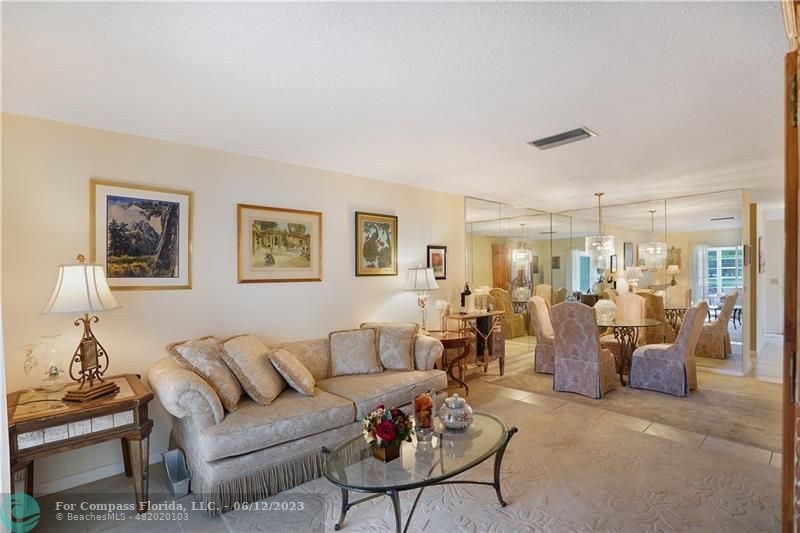 8625 Boca Drive, Unit 12 Boca Raton, FL 33433 - Photo 20 of 42 a living room with lots of furniture and a view of kitchen