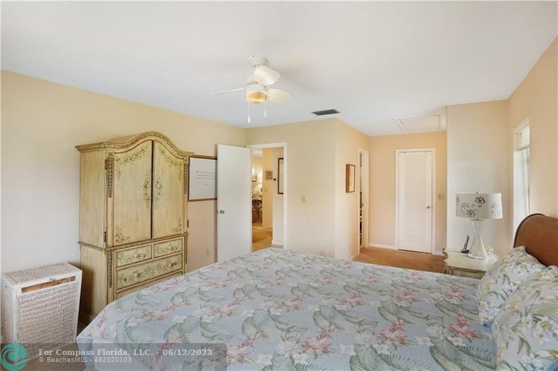 8625 Boca Drive, Unit 12 Boca Raton, FL 33433 - Photo 22 of 42 a spacious bedroom with a bed and a shower