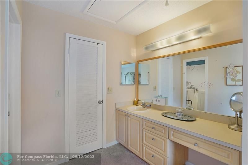 8625 Boca Drive, Unit 12 Boca Raton, FL 33433 - Photo 24 of 42 a bathroom with a sink double vanity and a mirror