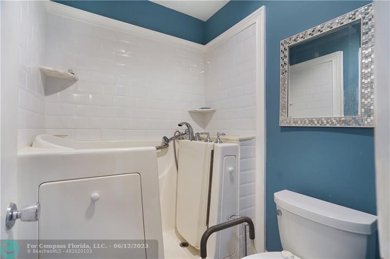 8625 Boca Drive, Unit 12 Boca Raton, FL 33433 - Photo 25 of 42 a bathroom with a toilet and a sink