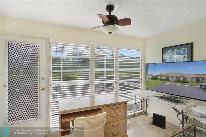 8625 Boca Drive, Unit 12 Boca Raton, FL 33433 - Photo 27 of 42 a kitchen with a stove a refrigerator and cabinets