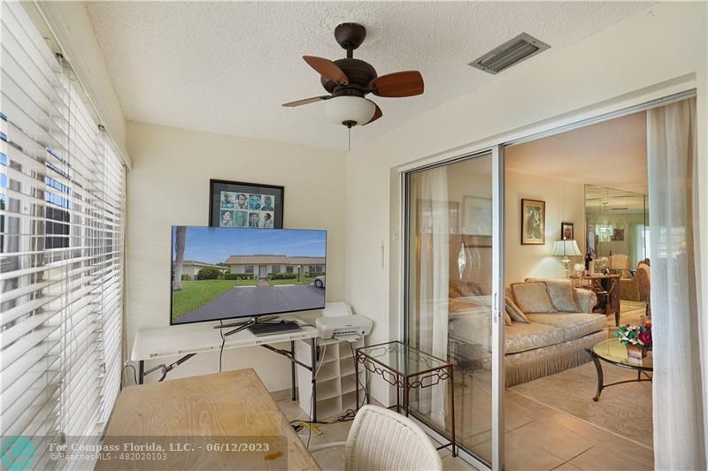 8625 Boca Drive, Unit 12 Boca Raton, FL 33433 - Photo 28 of 42 a living room with furniture and a flat screen tv