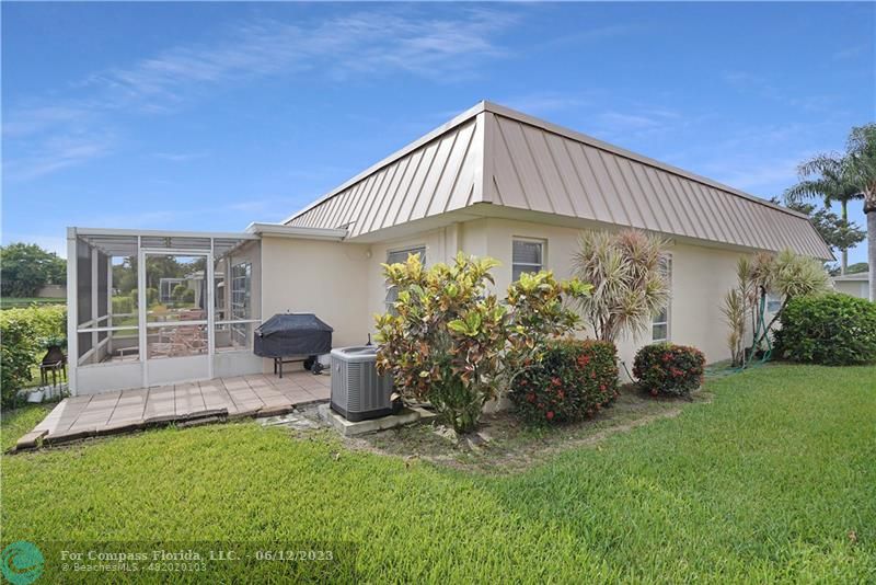 8625 Boca Drive, Unit 12 Boca Raton, FL 33433 - Photo 30 of 42 a backyard of a house with seating space