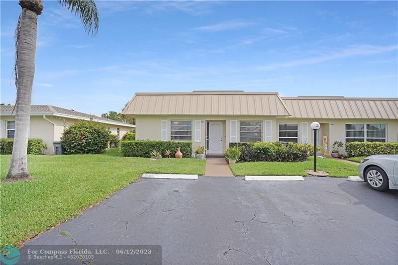 8625 Boca Drive, Unit 12 Boca Raton, FL 33433 - Photo 3 of 42 a view of a house with a yard and pathway