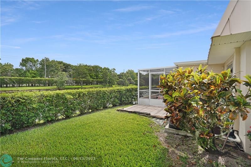 8625 Boca Drive, Unit 12 Boca Raton, FL 33433 - Photo 31 of 42 a view of a garden with a lake