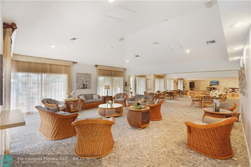 8625 Boca Drive, Unit 12 Boca Raton, FL 33433 - Photo 34 of 42 a living room with furniture and a large window