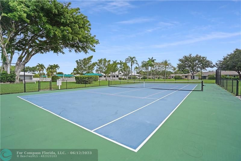 8625 Boca Drive, Unit 12 Boca Raton, FL 33433 - Photo 40 of 42 a view of an outdoor space and tennis court