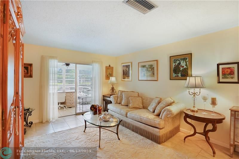 8625 Boca Drive, Unit 12 Boca Raton, FL 33433 - Photo 4 of 42 a living room with furniture and a window