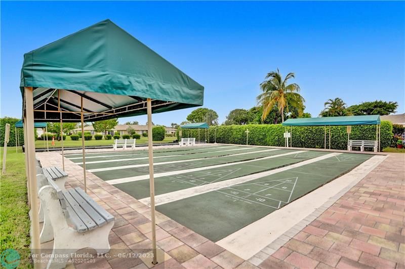 8625 Boca Drive, Unit 12 Boca Raton, FL 33433 - Photo 41 of 42 a view of a tennis ground with a small pool