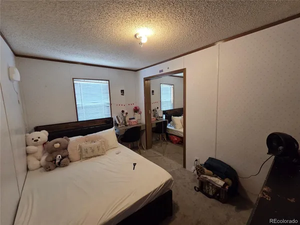 a bedroom with a bed and furniture