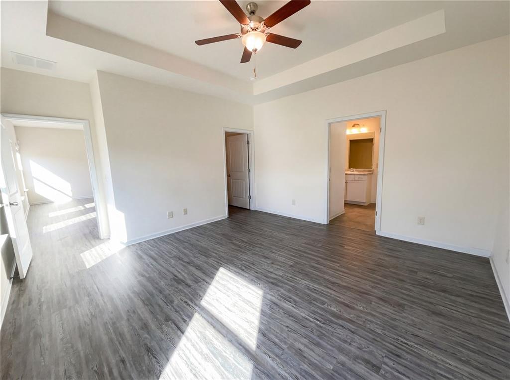2682 North Broad Street Extension Northeast Rome, GA 30161 - Photo 4 of 23 wooden floor in an empty room with a window