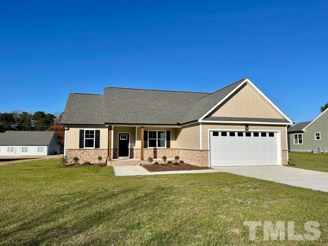5770 Stott Street Bailey, NC 27807 - Photo 1 of 16 a front view of a house with garden