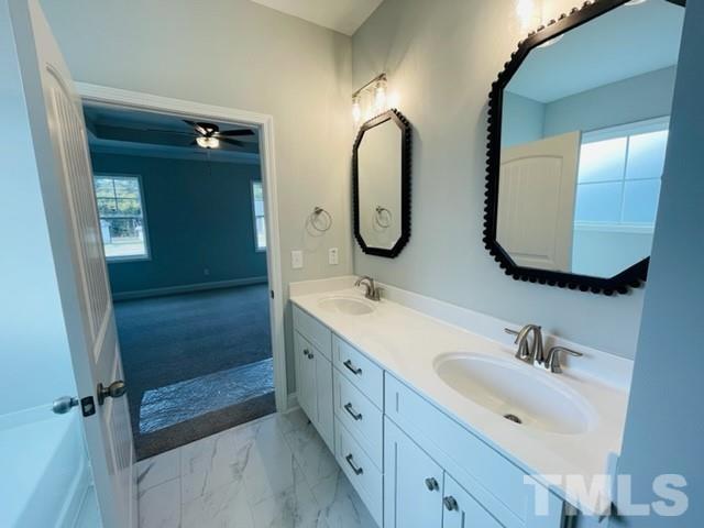 5770 Stott Street Bailey, NC 27807 - Photo 11 of 16 a spacious bathroom with a double vanity sink double and mirror