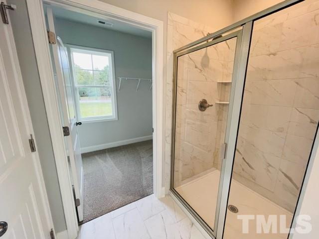 5770 Stott Street Bailey, NC 27807 - Photo 12 of 16 a bathroom with a glass door shower and vanity