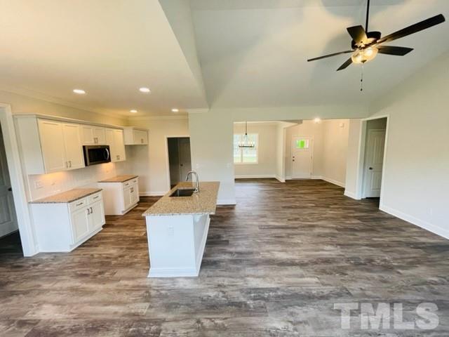 5770 Stott Street Bailey, NC 27807 - Photo 7 of 16 a living room with kitchen island furniture and a kitchen view