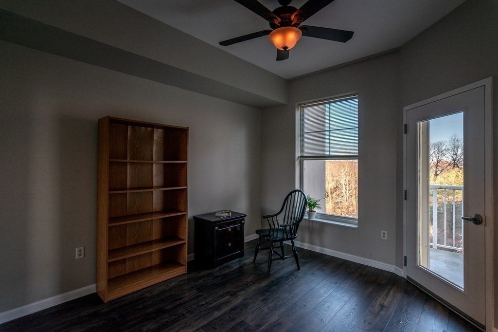 38 Village Road, Unit 615 Middleton, MA 01949 - Photo 12 of 23 wooden floor in an empty room with a window