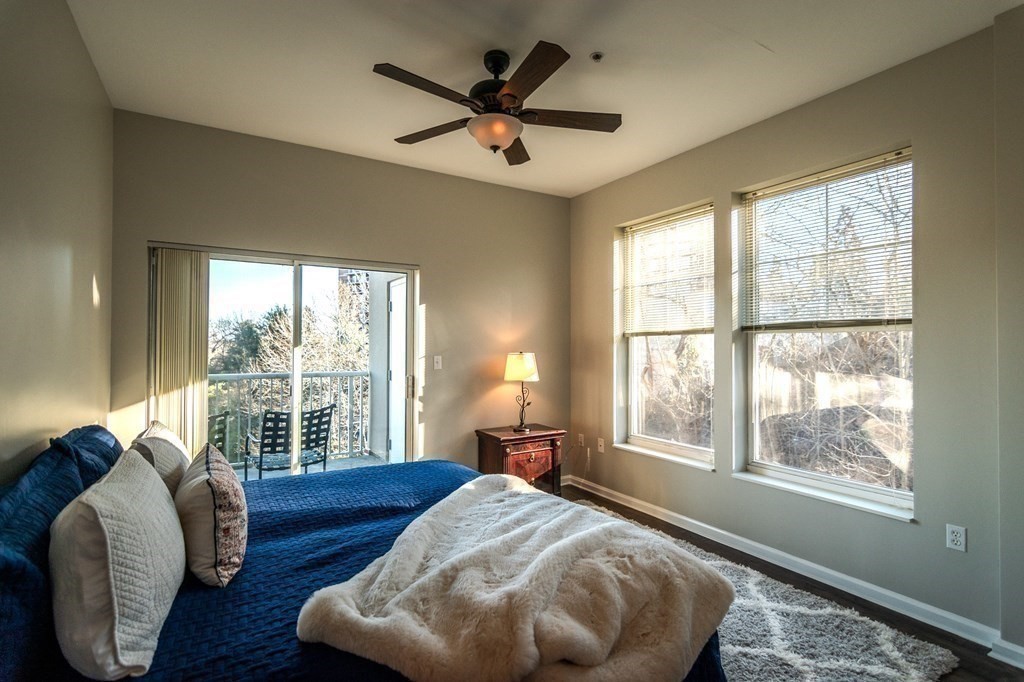 38 Village Road, Unit 615 Middleton, MA 01949 - Photo 14 of 23 a bedroom with a bed and a large window