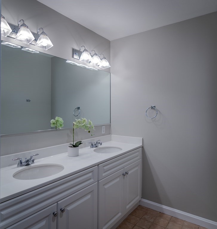 38 Village Road, Unit 615 Middleton, MA 01949 - Photo 17 of 23 a bathroom with a sink and a mirror