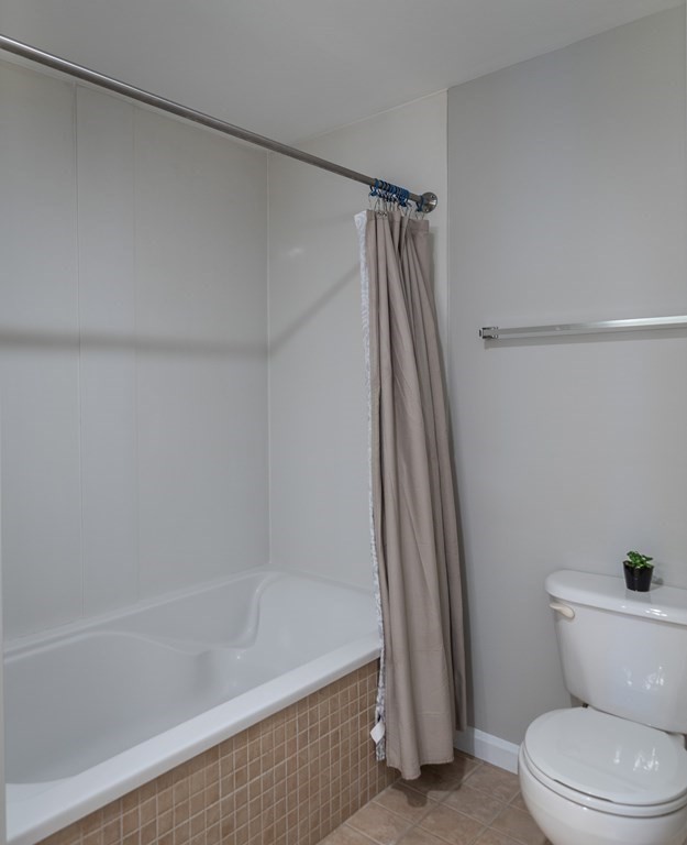 38 Village Road, Unit 615 Middleton, MA 01949 - Photo 18 of 23 a bathroom with a shower and a toilet