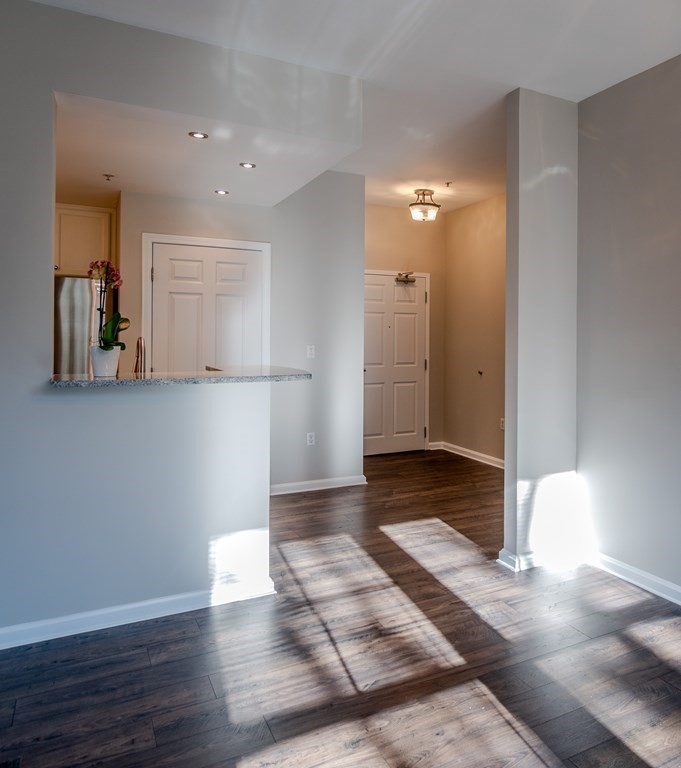 38 Village Road, Unit 615 Middleton, MA 01949 - Photo 4 of 23 a view of a hallway with wooden floor