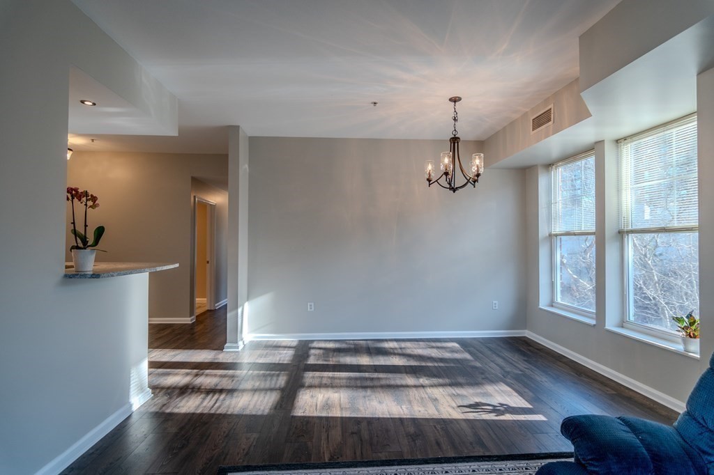 38 Village Road, Unit 615 Middleton, MA 01949 - Photo 5 of 23 a view of entryway and hall with wooden floor