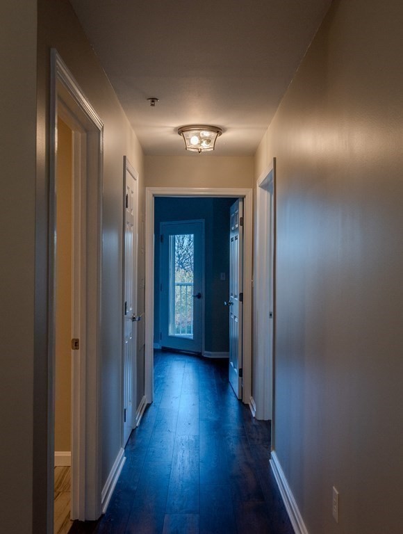 38 Village Road, Unit 615 Middleton, MA 01949 - Photo 10 of 23 a view of a hallway with wooden floor