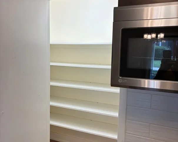 a view of a livingroom with wooden floor
