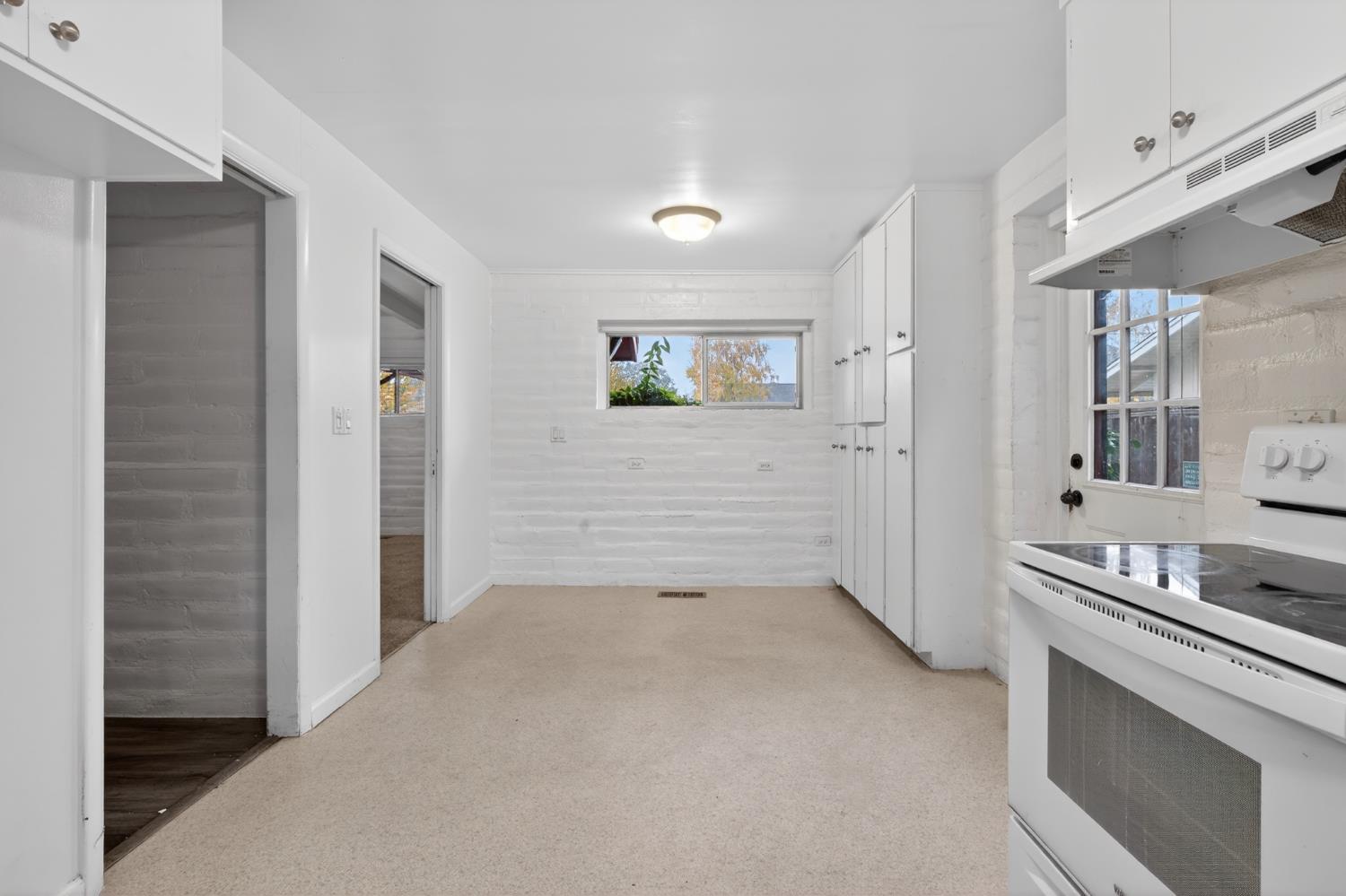 1140 West Lincoln Road Stockton, CA 95207 - Photo 12 of 45 a view of a hallway with bathroom and mirror