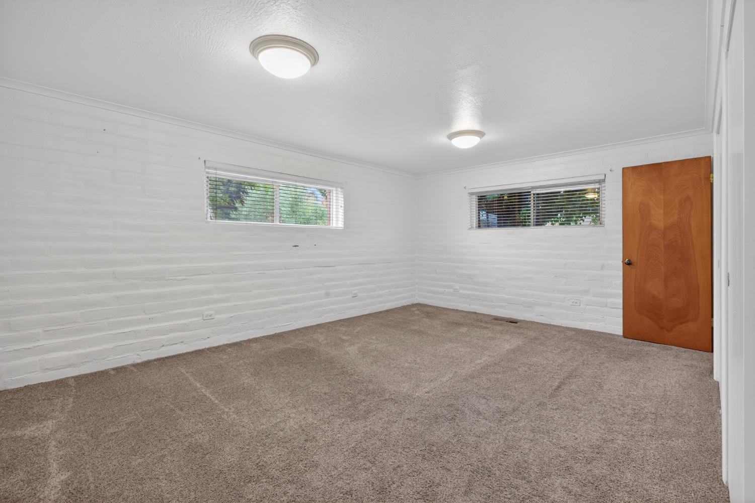 1140 West Lincoln Road Stockton, CA 95207 - Photo 16 of 45 a view of an empty room with a window