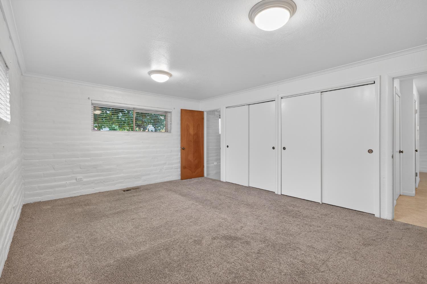 1140 West Lincoln Road Stockton, CA 95207 - Photo 17 of 45 a view of an empty room with a window