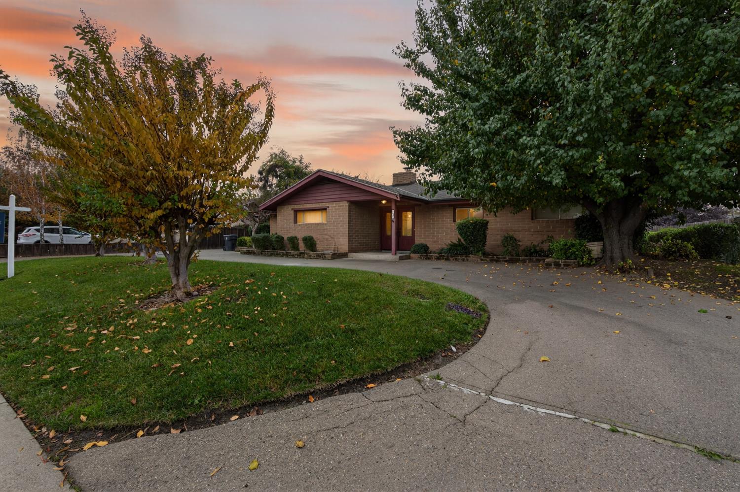 1140 West Lincoln Road Stockton, CA 95207 - Photo 2 of 45 a front view of a house with a yard and trees