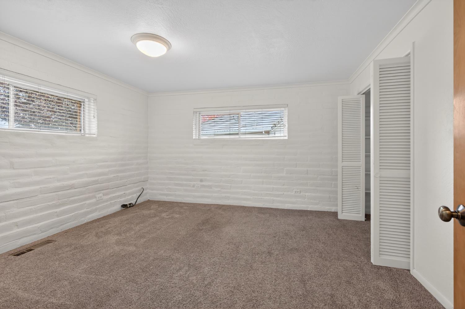 1140 West Lincoln Road Stockton, CA 95207 - Photo 26 of 45 an empty room with windows