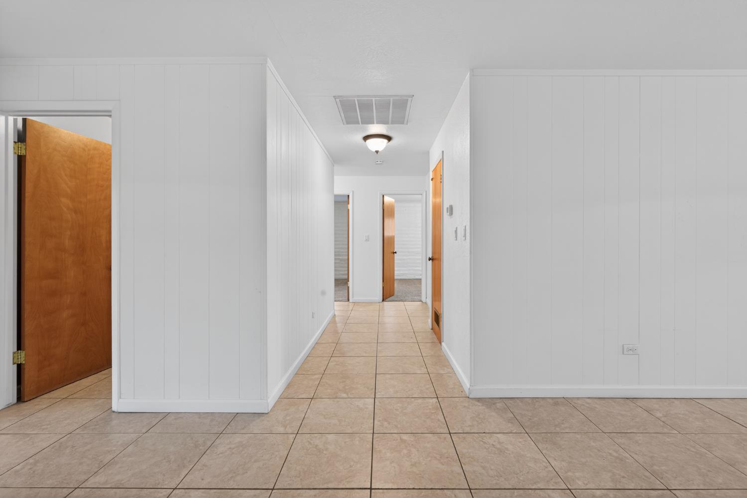 1140 West Lincoln Road Stockton, CA 95207 - Photo 27 of 45 a view of a hallway with closet and a bathroom