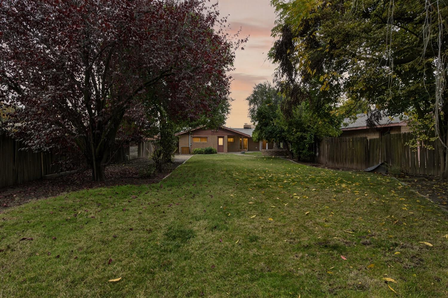 1140 West Lincoln Road Stockton, CA 95207 - Photo 34 of 45 a view of a backyard with large trees