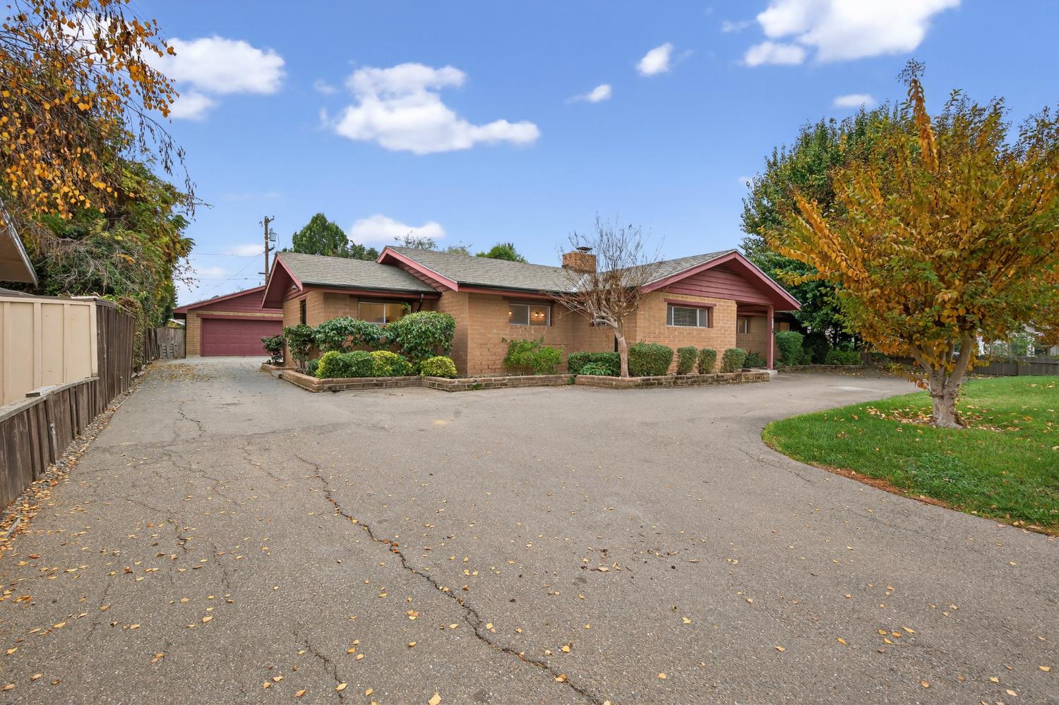 1140 West Lincoln Road Stockton, CA 95207 - Photo 5 of 45 a front view of a house with a yard and garage
