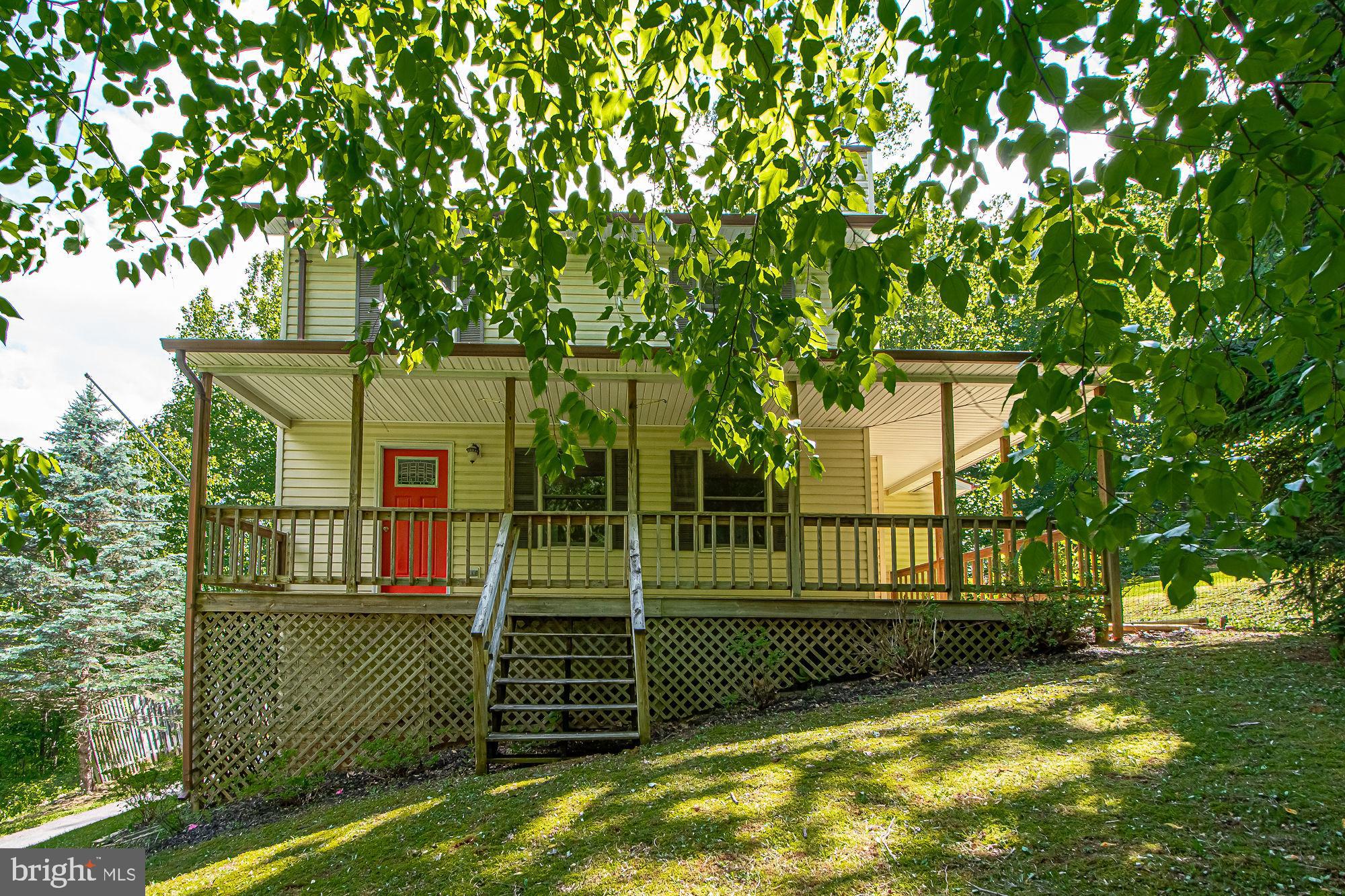 302 Parkside Road Linden, VA 22642 - Photo 1 of 30 a view of a house with a backyard
