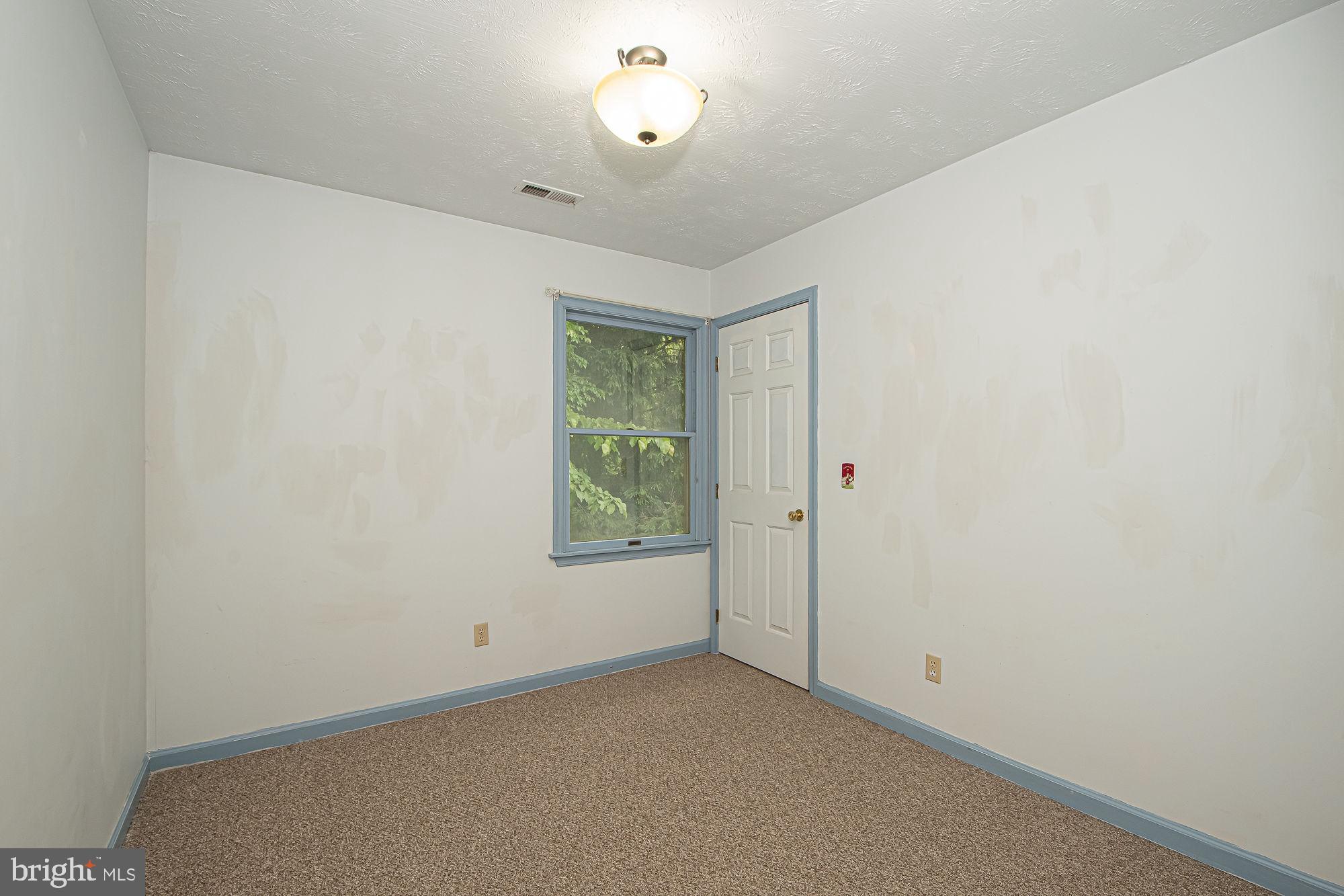 302 Parkside Road Linden, VA 22642 - Photo 14 of 30 an empty room with a window
