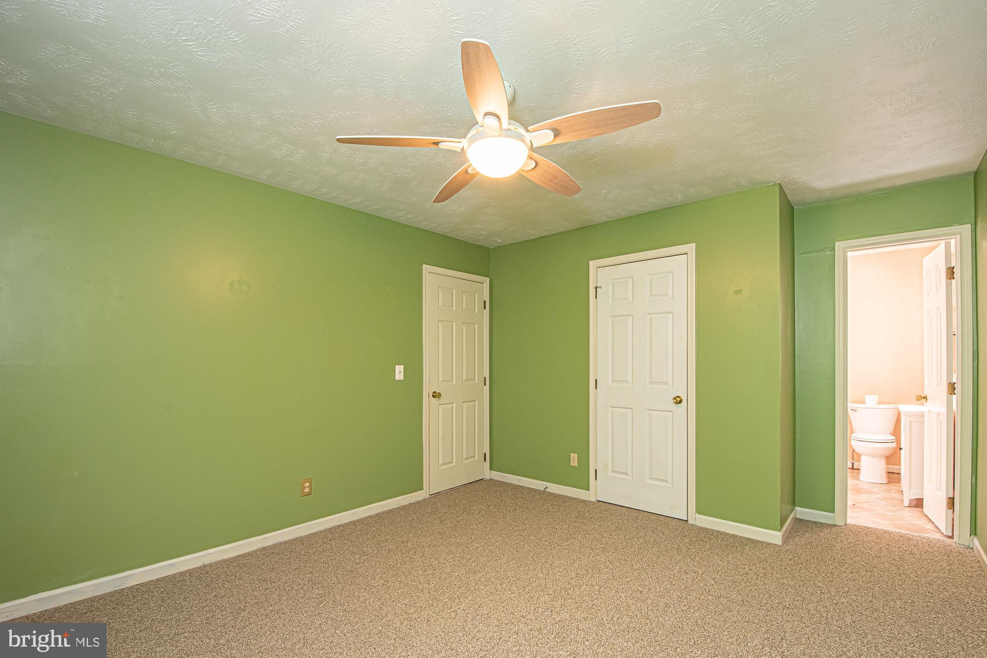 302 Parkside Road Linden, VA 22642 - Photo 21 of 30 a view of an empty room and chandelier fan