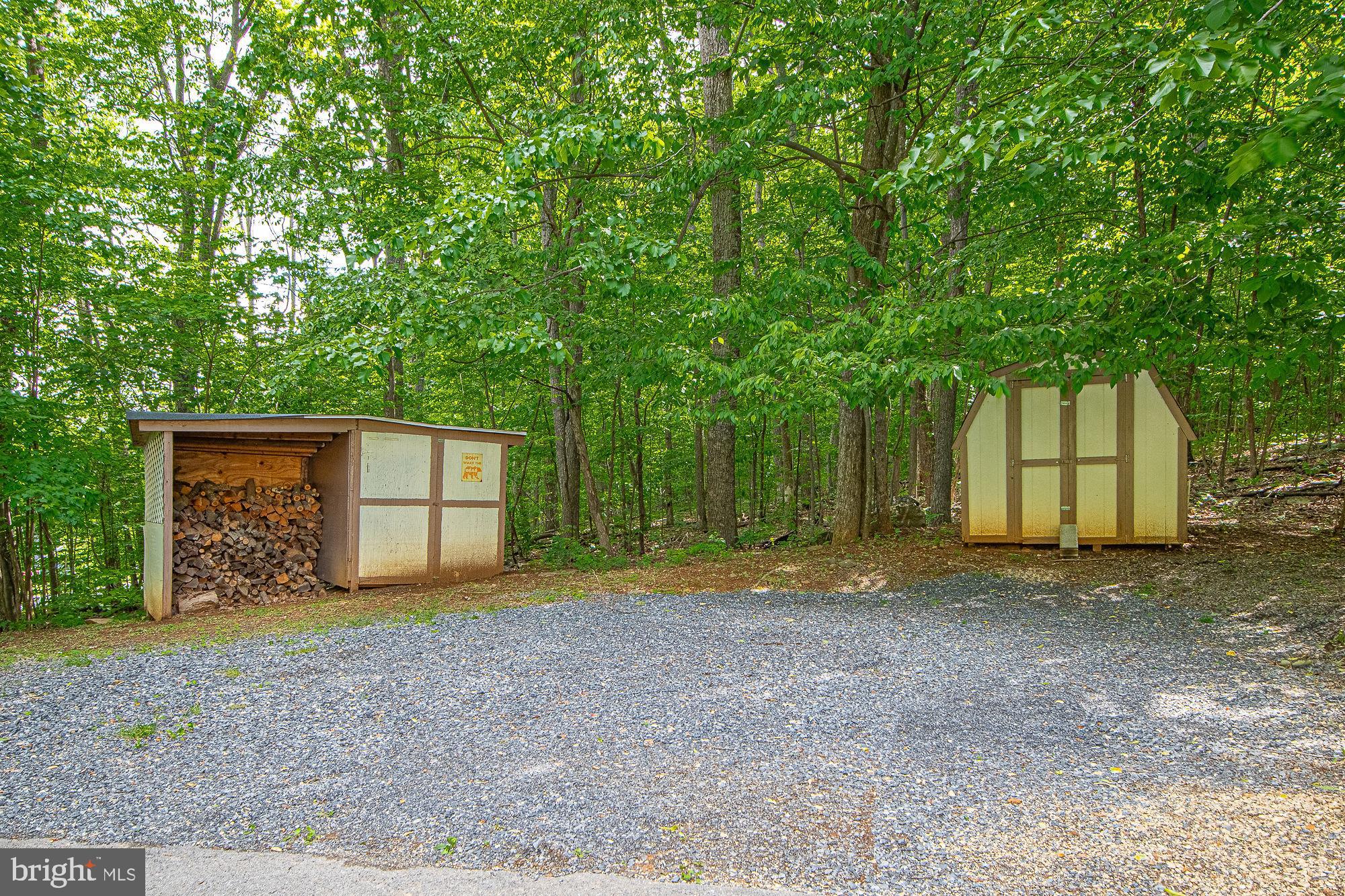 302 Parkside Road Linden, VA 22642 - Photo 28 of 30 a view of a house with large tree and wooden fence