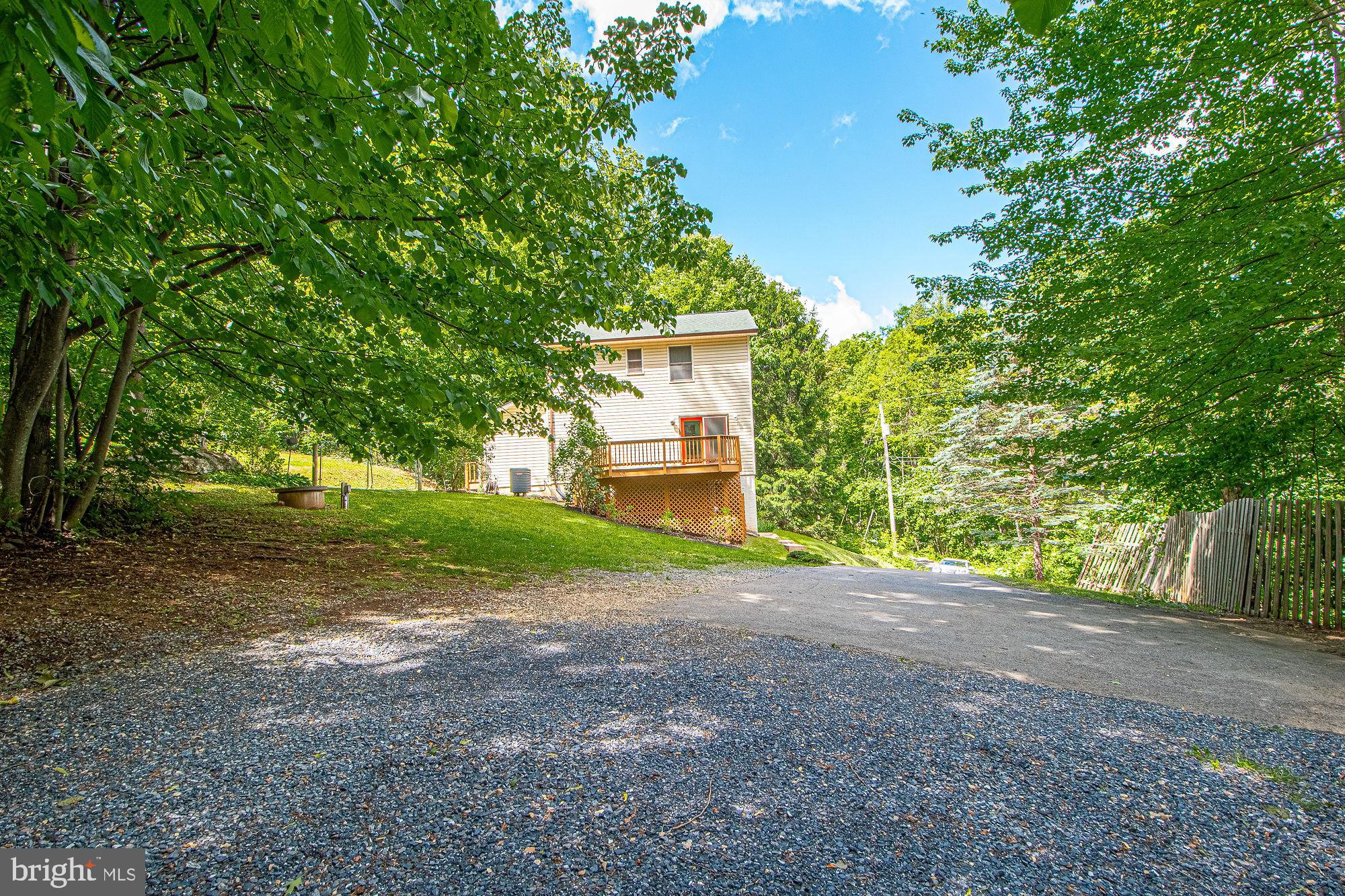 302 Parkside Road Linden, VA 22642 - Photo 29 of 30 a view of a house with yard and a tree