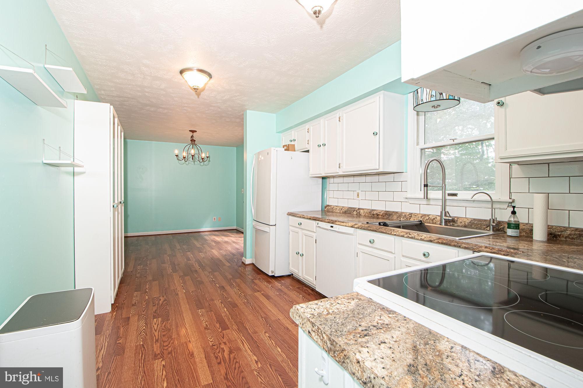 302 Parkside Road Linden, VA 22642 - Photo 6 of 30 a kitchen with a sink stove and refrigerator