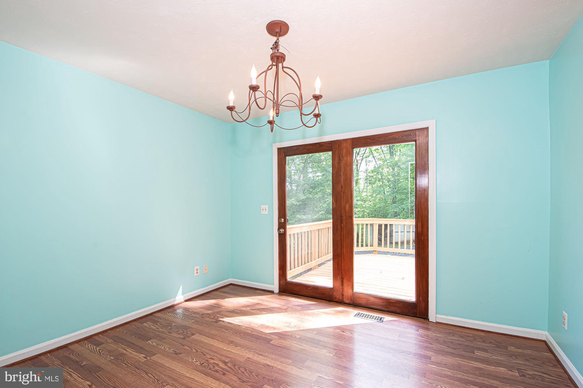 302 Parkside Road Linden, VA 22642 - Photo 8 of 30 a view of empty room with wooden floor and fan