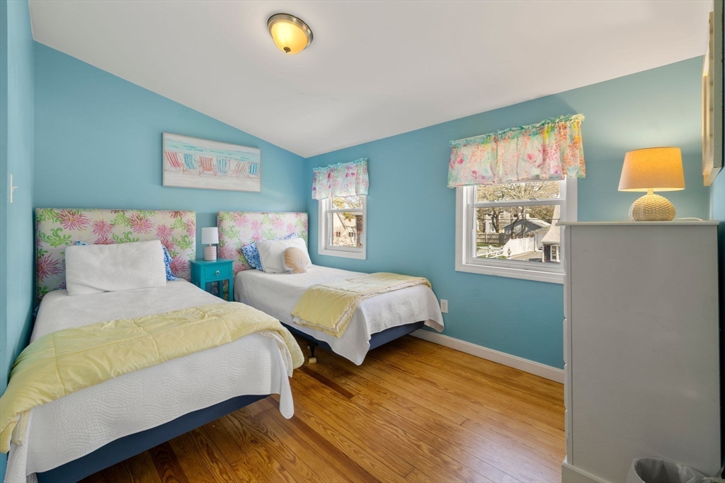 13 Hamilton Road Dennis, MA 02639 - Photo 12 of 40 a bedroom with two beds and a window