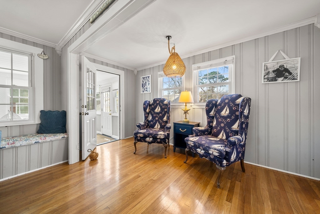 13 Hamilton Road Dennis, MA 02639 - Photo 16 of 40 a living room with furniture and a large window