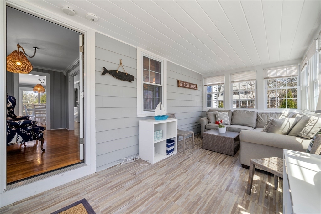 13 Hamilton Road Dennis, MA 02639 - Photo 19 of 40 a living room with furniture and a wooden floor