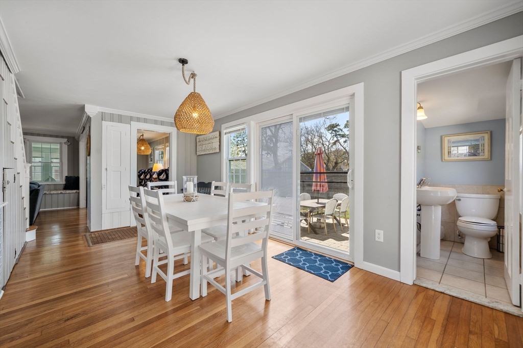 13 Hamilton Road Dennis, MA 02639 - Photo 23 of 40 a view of a livingroom with furniture wooden floor a chandelier