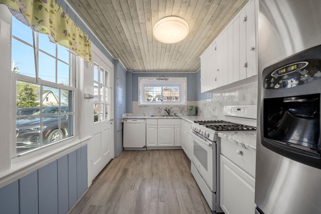 13 Hamilton Road Dennis, MA 02639 - Photo 25 of 40 a large kitchen with a stove top oven