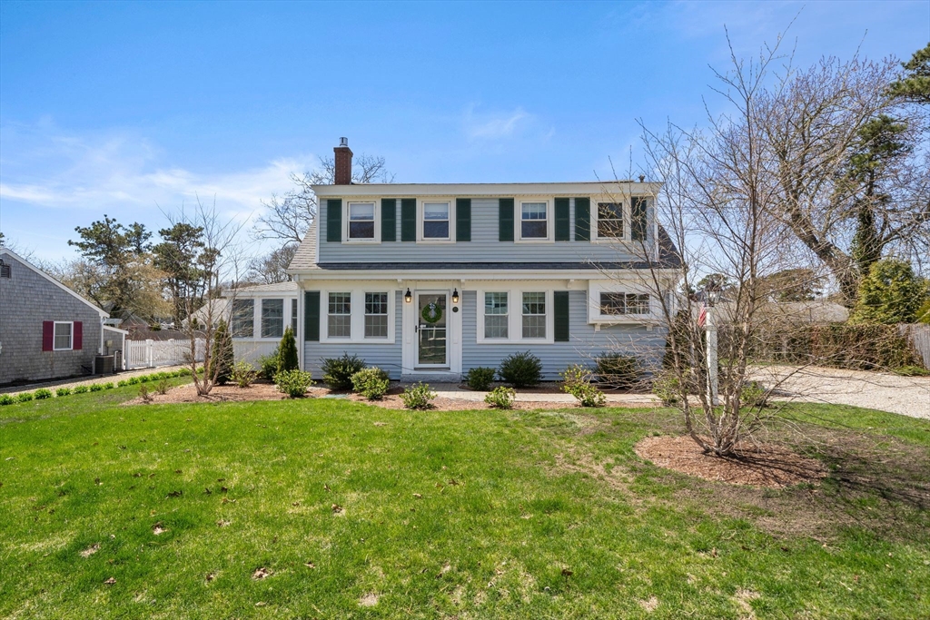 13 Hamilton Road Dennis, MA 02639 - Photo 30 of 40 a front view of a house with a yard