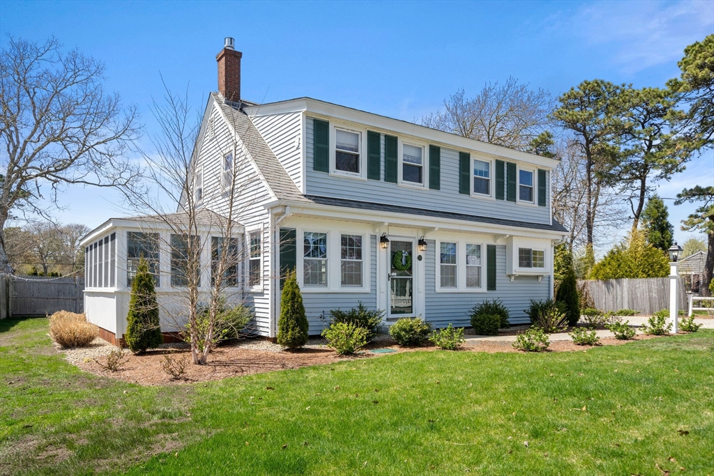 13 Hamilton Road Dennis, MA 02639 - Photo 31 of 40 a front view of a house with a yard and porch